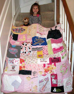 Girl on stairs with Baby Clothes Quilt
