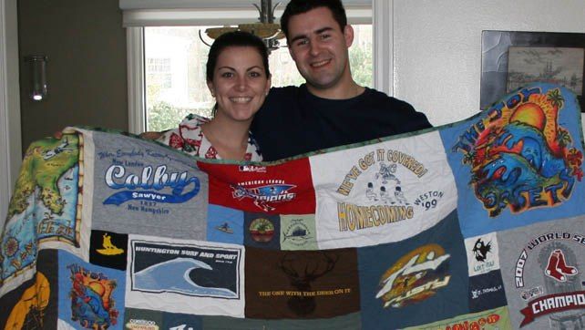 Couple holding T-shirt quilt