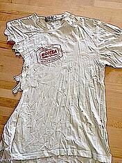 Now this is a T-shirt that has seen a good life. We can still use this is a quilt.