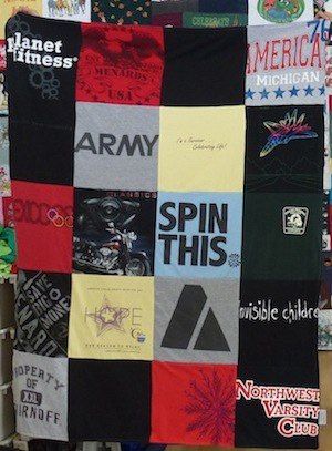 traditional style T-shirt quilt laid out in rows and columns.