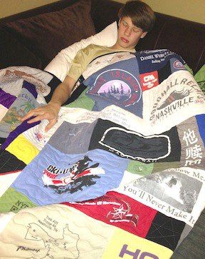 A young man sleeping under his T-shirt quilt