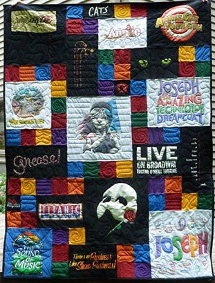 Theater T-shirt quilts was made larger with blank blocks. 