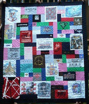 This is T-shirt quilt with blank block fillers to increase the size of the quilt. 
