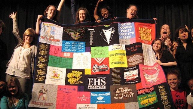 Kids holding up a Too Coo T-shirt Quilt