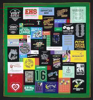 A great graduation T-shirt quilt with a 4" solid green border.