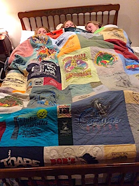 3 girls sleeping under a T-shirt quilt by Too Cool T-shirt Quilts
