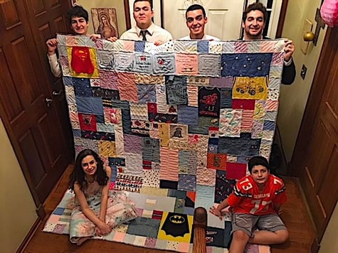 6 kids with their mom's quilt made from their baby clothes.by Too Cool T-shirt Quilts