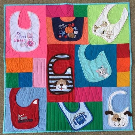 quilt made from baby bibs