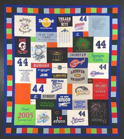 T-shirt quilt with a 2" solid + 4" pieced + 2" solid border