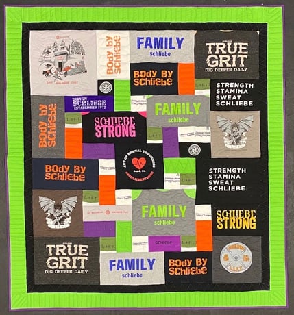 T-shirt quilt with a 4" + 2" solid border