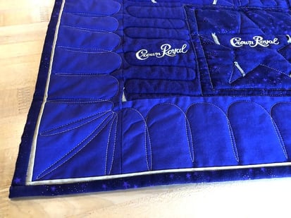 Crown royal quilt close up with piping