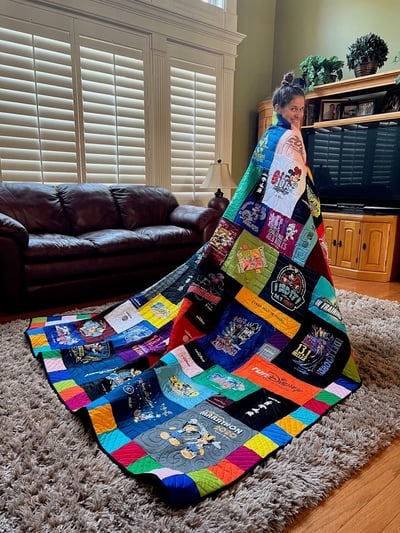A True Disney princess wrapped up in her Too Cool T-shirt Quilt