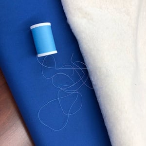 Fabric batting and thread used in a T-shirt quilt