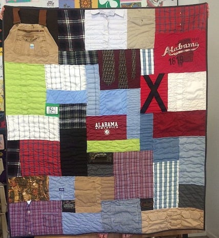A clothing memorial quilt that includes dress shirts, overalls, suspenders and jeans.Memorial quilts by Too Cool T-shirt Quilts