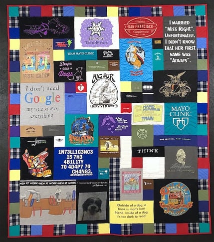 Memorial quilt with plaid and solid color border.