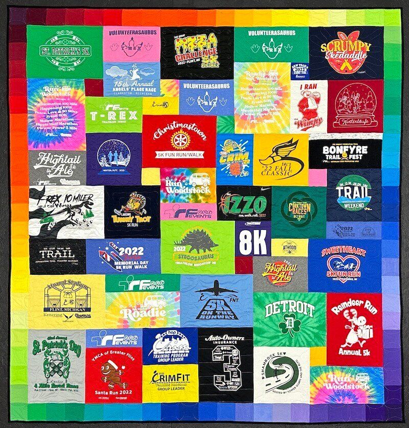  T-shirt Quilt with a rainbow border by Too Cool T-shirt Quilts