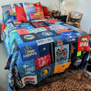 Runners quilt and pillow on bed. T-shirt Pillows by Too Cool T-shirt Quilts