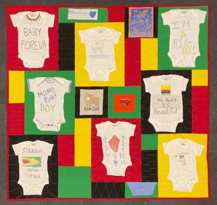 Baby Onesies turned into a quilt. Onesies were created at a baby shower and then transformed into quilt when the lucky baby turned 1.
