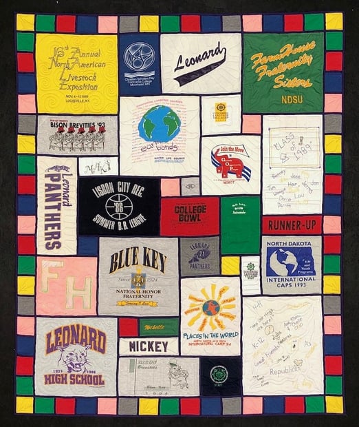 Stained glass T-shirt quilt with a 4 pieced border by Too Cool T-shirt quilts
