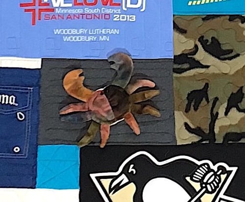Stuffed animal on a T-shirt quilt