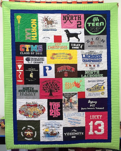 Graduation T-shirt quilt with a blue and lime green border.