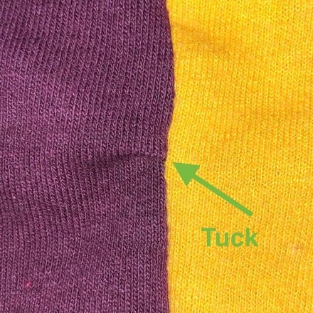 This photograph show a tuck in a seam of a T-shirt quilt looks like.