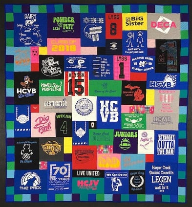 This is one awesome T-shirt quilt. It's has a 4" pieced border in blues, greens and purples.