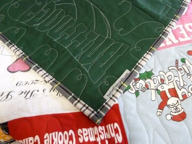 binding made from a school uniform skirt on a T-shirt quilt