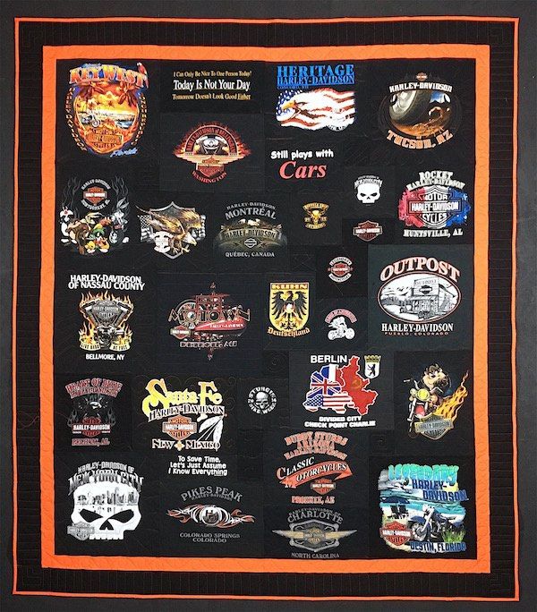 A black T-shirt quilt with an orange border.