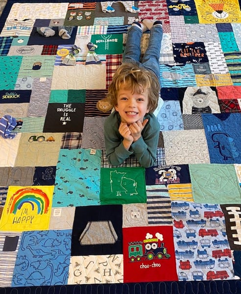 cute boy on baby clothes quilt by Too Cool T-shirt Quilts