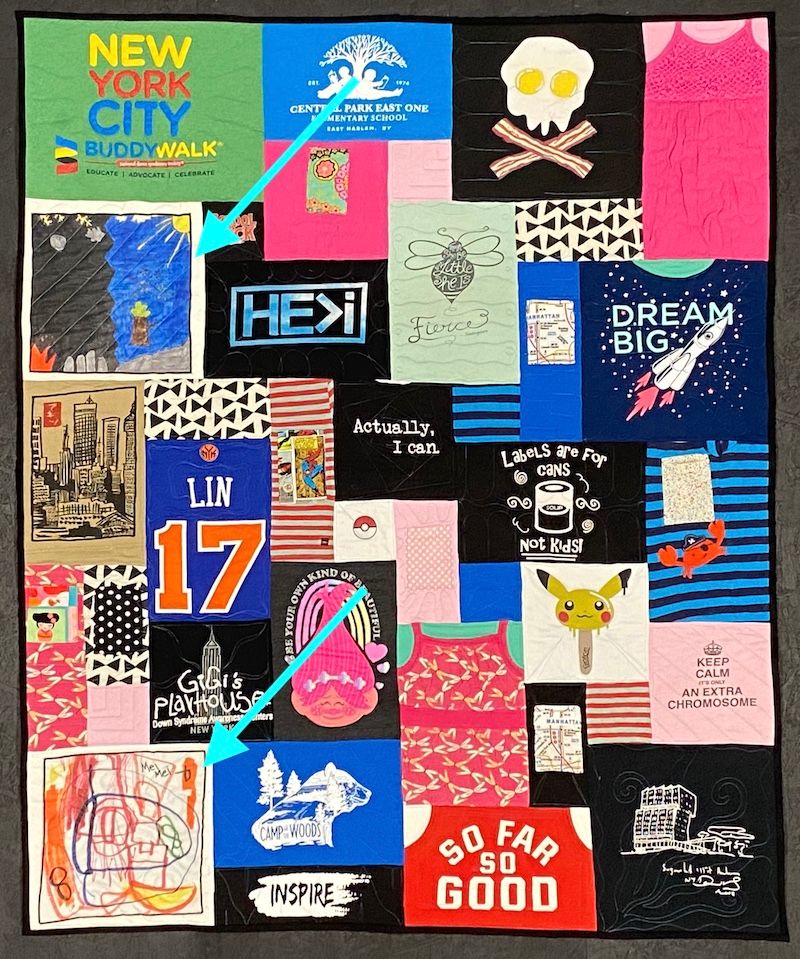 T-shirt quilt with the kid's artwork pointed out