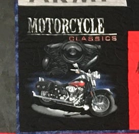 Image of a T-shirt quilt block that includes the entire graphic from a T-shirt. 