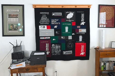 quilt hanging in office made by Too Cool T-shirt Quilts