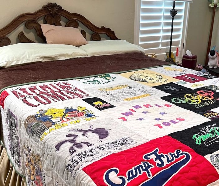 T-shirt quilt on bed folded down