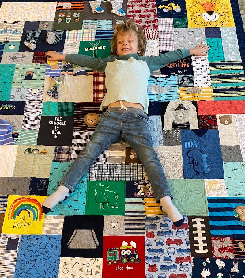 super cute boy on baby clothes quilt by Too Cool T-shirt Quilts