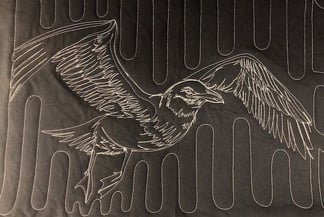 traced bird on a too cool T-shirt quilt 