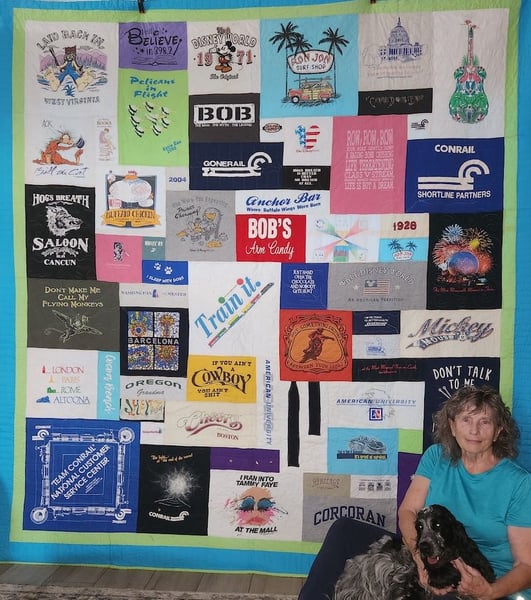 woman and dog with T-shirt quilt with a double border