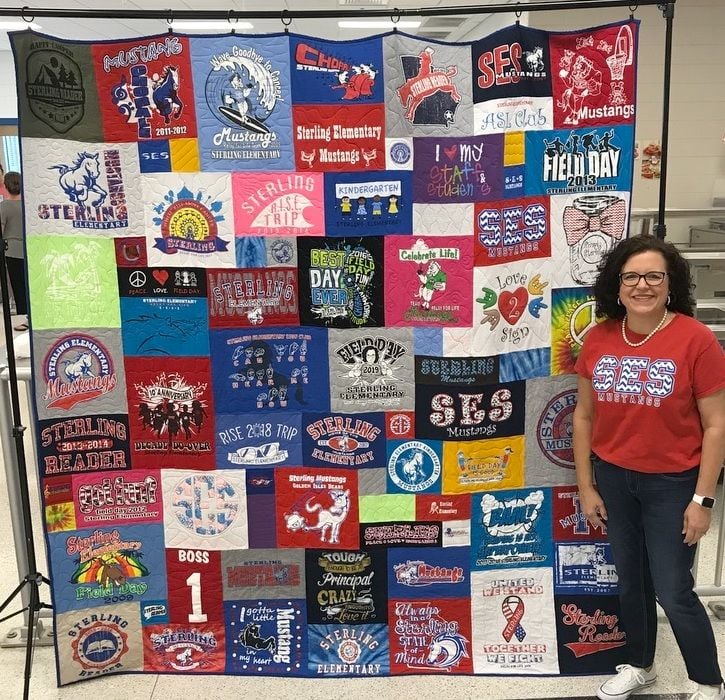 Woman loves her T-shirt quilt by Too Cool T-shirt Quilts