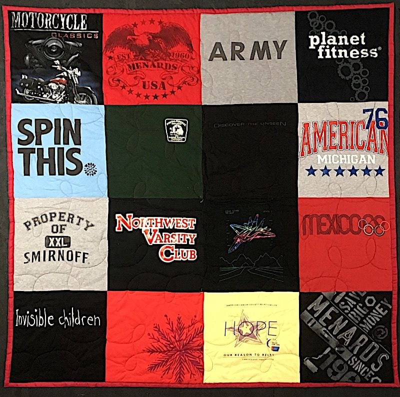 Traditional style T-shirt quilt with how stupid small logos look cut with a huge block.